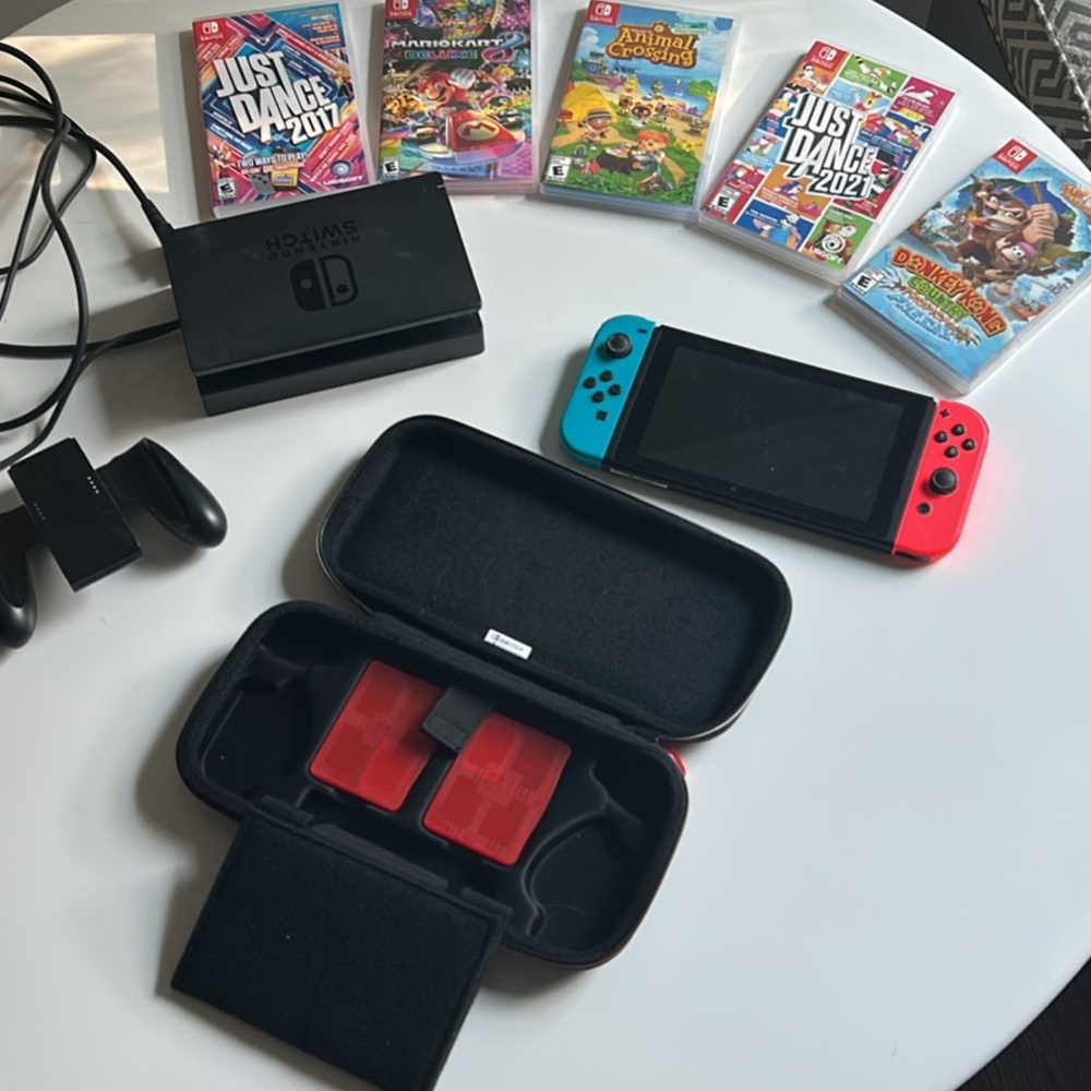Nintendo Switch with assorted games and travel case